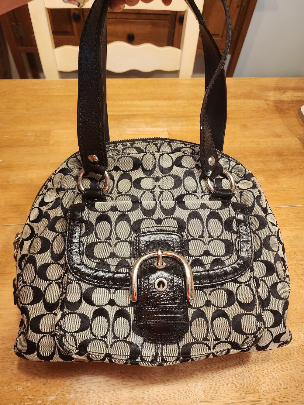 black and silver Coach Soho Signature Dome Satchel